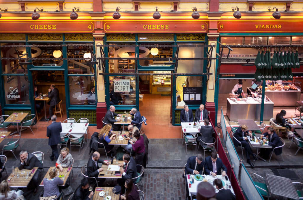 Cheese at Leadenhall - A birds eye view of outdoor seating area in Leadenhall Market where people are enjoying food