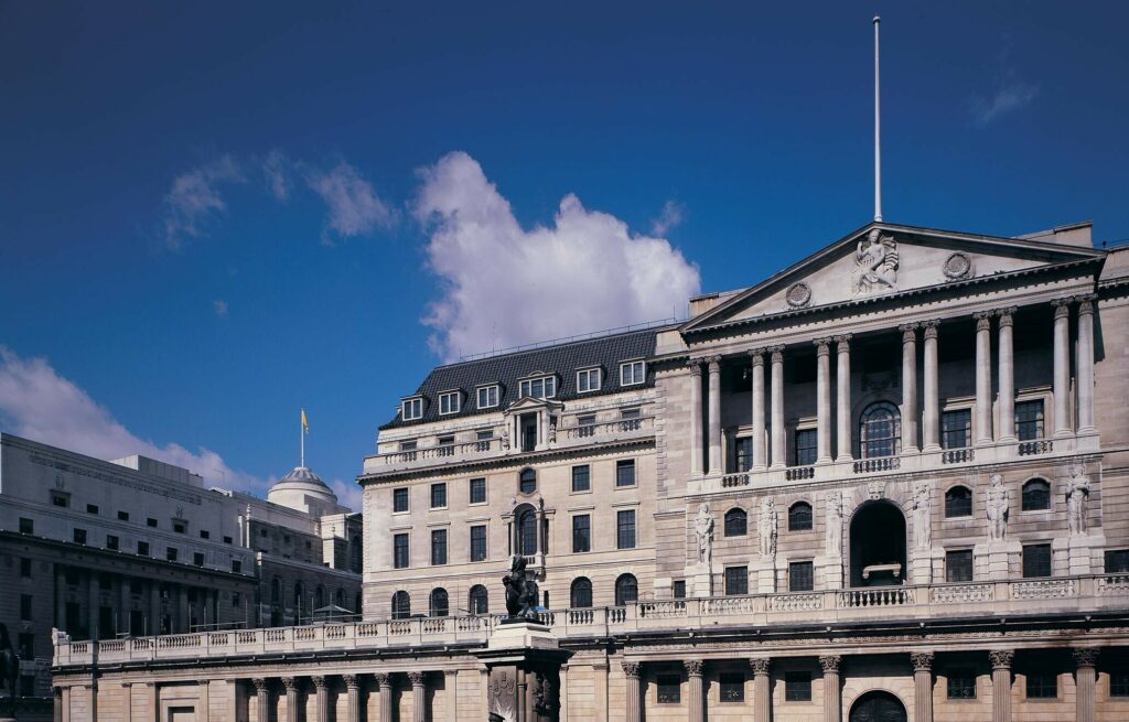 Exterior of the Bank of England, a large building made of white stone.