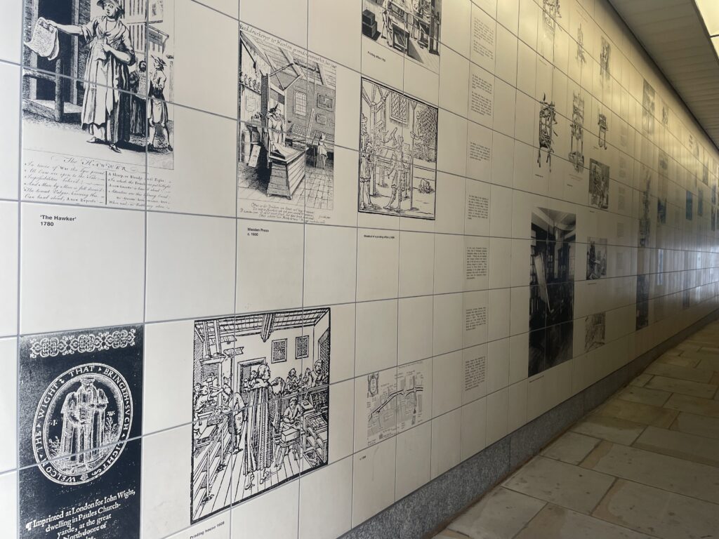 Tiles depicting the history of the printed word in Fleet Street in Magpie Alley