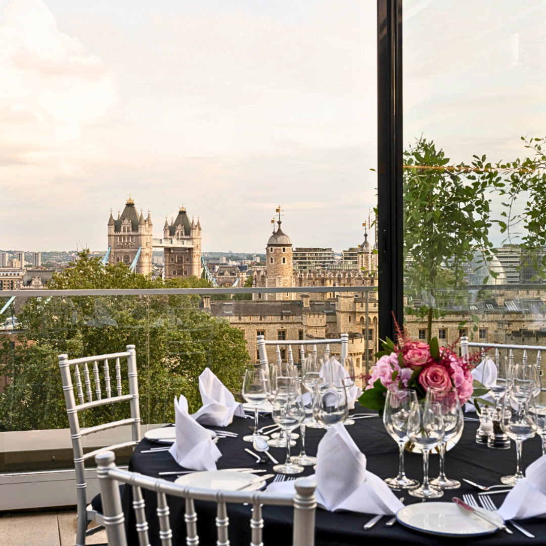 Festive table and views of Tower Bridge and the Tower of London through the glass window